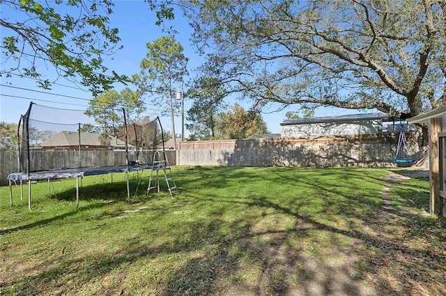 view of yard featuring a trampoline