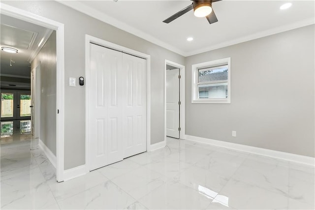 unfurnished bedroom with ceiling fan, ornamental molding, and multiple windows