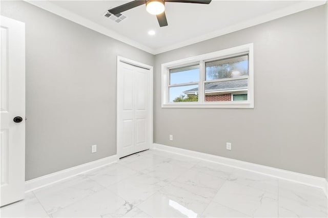 unfurnished bedroom featuring a closet, ceiling fan, and crown molding