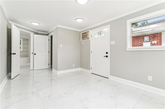 entrance foyer featuring an AC wall unit and ornamental molding