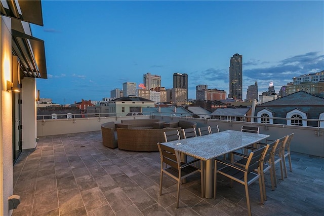 patio terrace at dusk with an outdoor living space