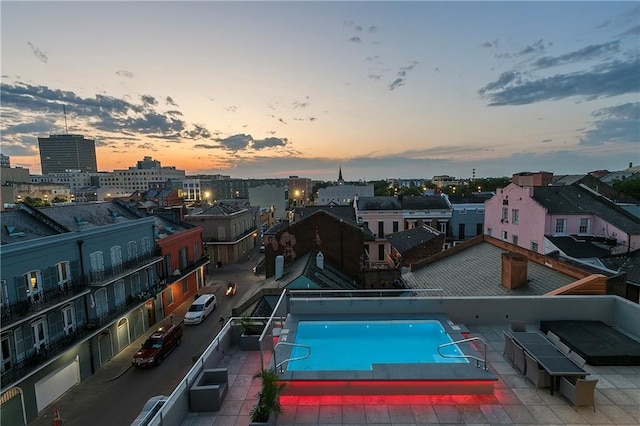 view of pool at dusk