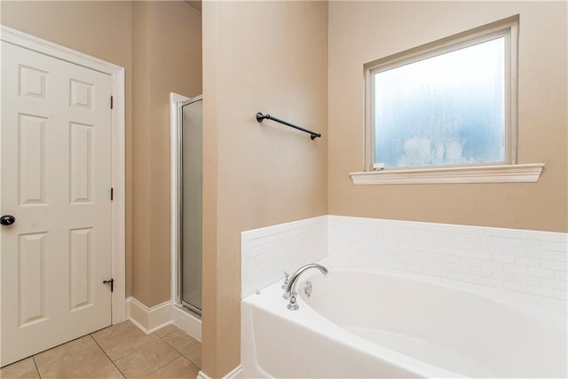 bathroom featuring tile patterned flooring and plus walk in shower