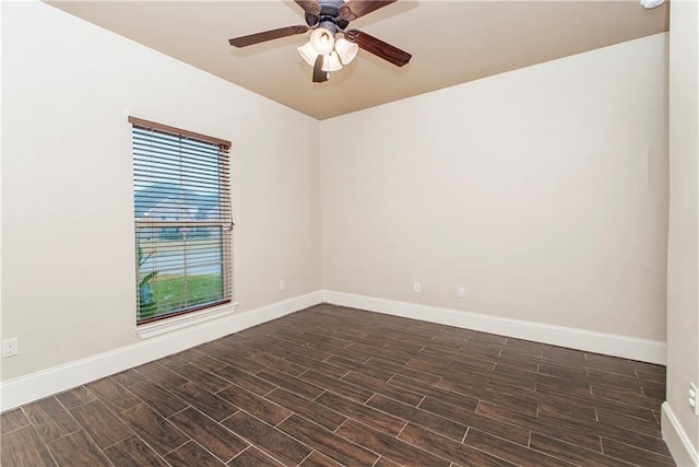 spare room featuring ceiling fan and dark hardwood / wood-style flooring