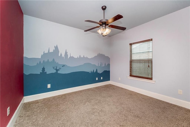 empty room with ceiling fan and carpet