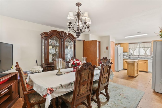 6301 S Rocheblave St, New Orleans, LA 70125 - dining area featuring a chandelier and light tile patterned floors