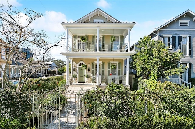 view of front facade featuring a balcony and covered porch