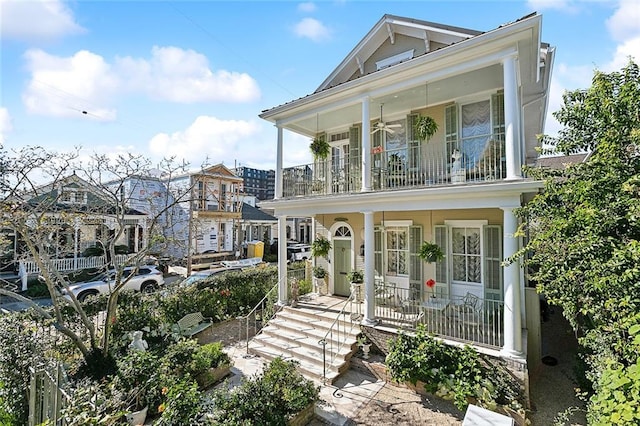 view of front of house with covered porch and a balcony