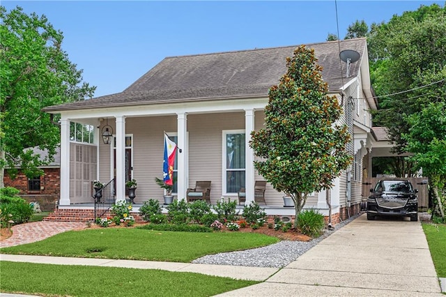 view of front of property with a porch and a front lawn