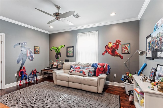 living room with hardwood / wood-style flooring, ceiling fan, and crown molding