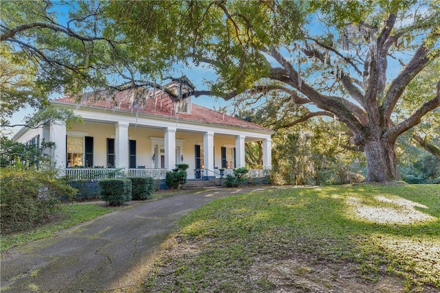 109 Carmel Church Rd, Natchez-Ms, MS 39120 - neoclassical / greek revival house featuring covered porch, a front lawn, and stucco siding