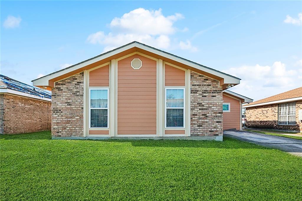 view of home's exterior featuring a yard