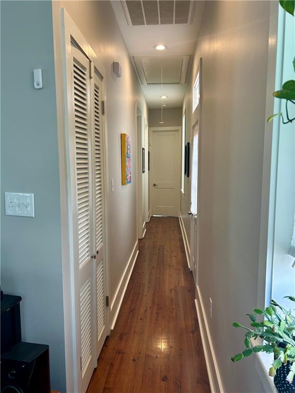 corridor featuring dark hardwood / wood-style floors