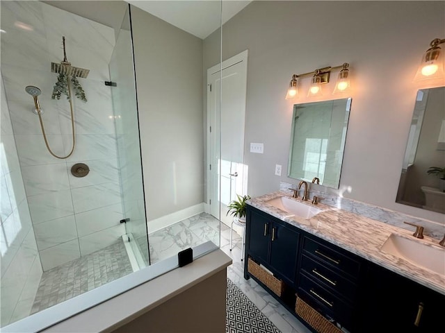 bathroom featuring vanity and tiled shower