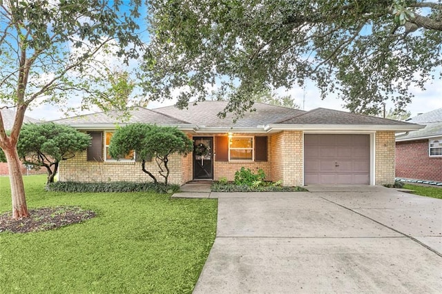 single story home with a front yard and a garage