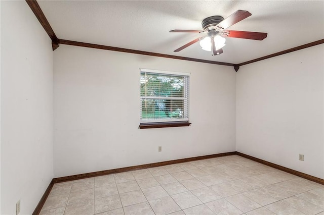 spare room with crown molding and ceiling fan