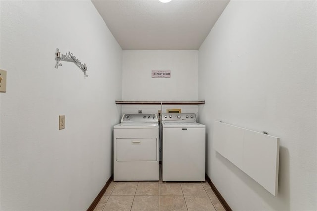 laundry room featuring independent washer and dryer and light tile patterned floors