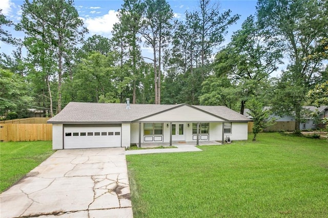 ranch-style house with a porch, an attached garage, fence, concrete driveway, and a front lawn