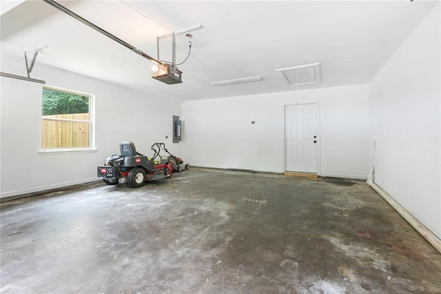 garage featuring electric panel and a garage door opener