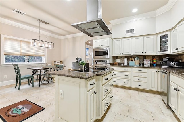 kitchen with pendant lighting, a center island, appliances with stainless steel finishes, tasteful backsplash, and island exhaust hood