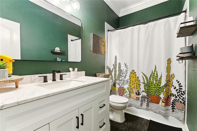 bathroom featuring toilet, vanity, and ornamental molding