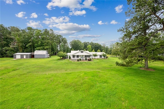 view of yard featuring covered porch