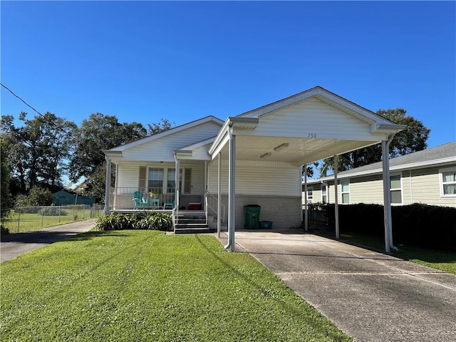 view of front facade with a porch, a carport, and a front lawn