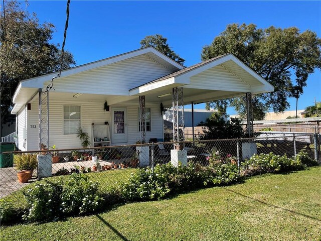 view of front of property with covered porch and a front yard