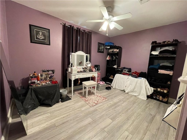 bedroom with ceiling fan and light hardwood / wood-style flooring