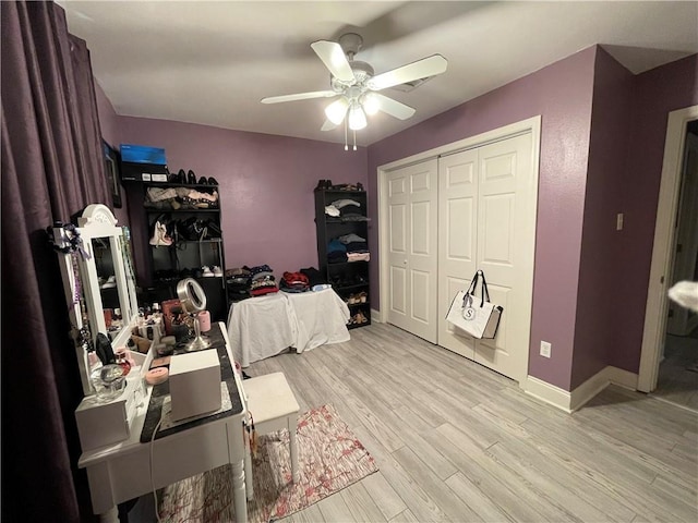 office featuring light wood-type flooring and ceiling fan