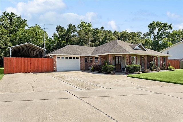 ranch-style home with a front yard and a garage