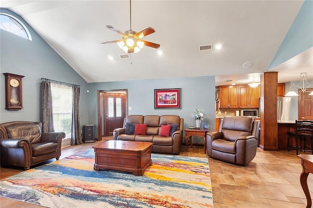 living room featuring high vaulted ceiling, a wealth of natural light, and ceiling fan