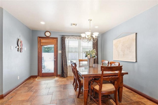 3 S Lake Ct, Violet, LA 70092 - dining space with a chandelier, stone tile floors, and recessed lighting