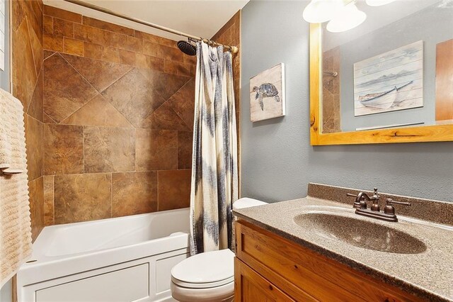 full bathroom featuring vanity, toilet, and shower / bathtub combination with curtain