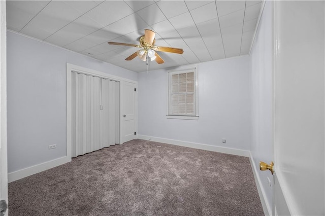 unfurnished bedroom with ceiling fan and carpet