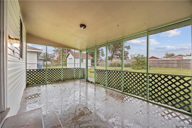 unfurnished sunroom featuring plenty of natural light