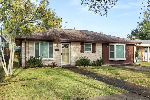 ranch-style house with a front lawn