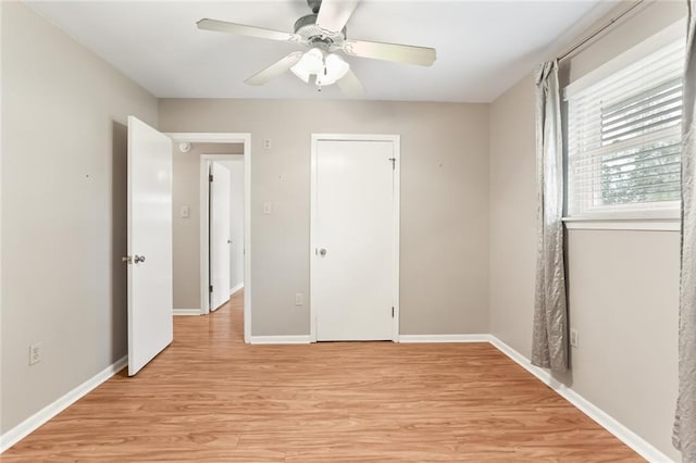 unfurnished bedroom featuring ceiling fan and light wood-type flooring