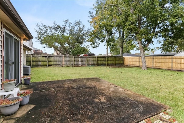 view of yard featuring a patio and central AC unit