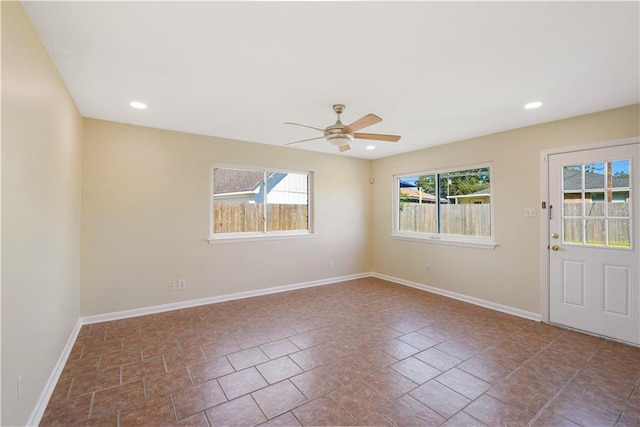 tiled empty room with ceiling fan