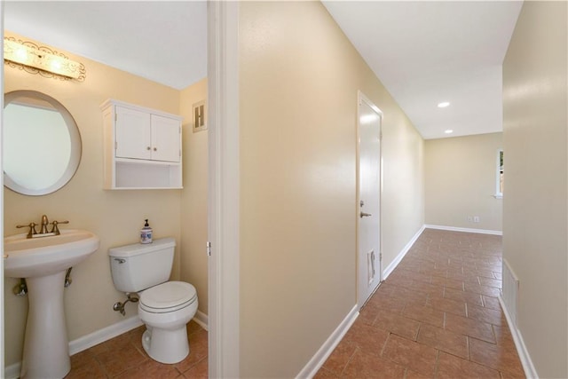 bathroom with toilet and sink