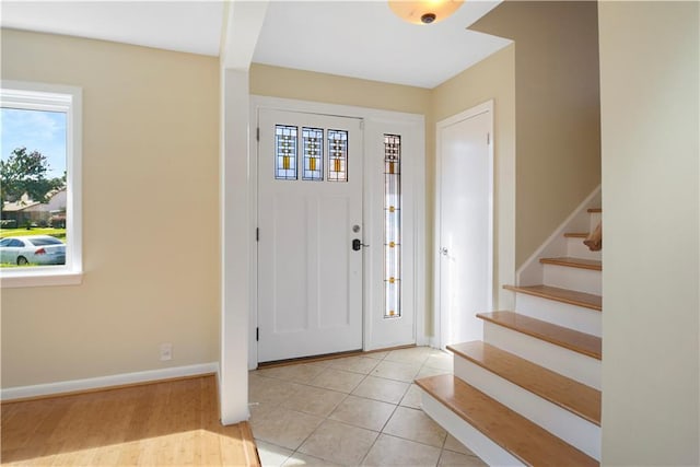 foyer featuring light tile patterned floors