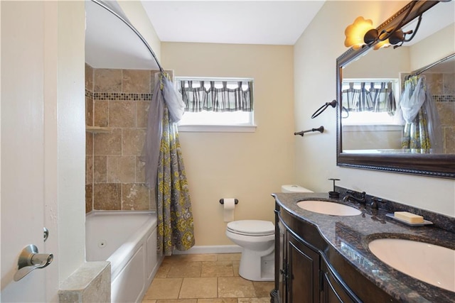 full bathroom featuring shower / tub combo with curtain, vanity, and toilet