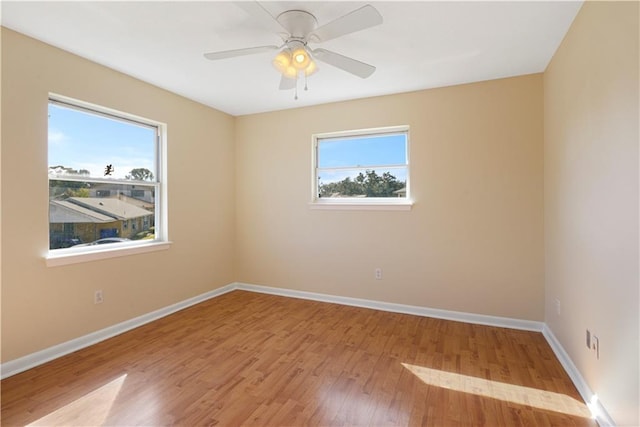 unfurnished room with ceiling fan and light hardwood / wood-style flooring