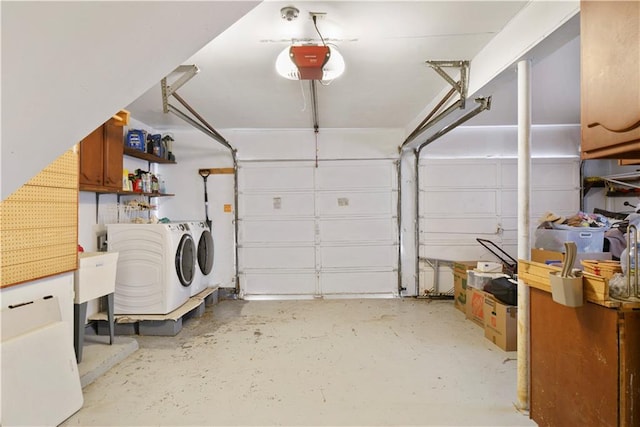 garage featuring separate washer and dryer and a garage door opener