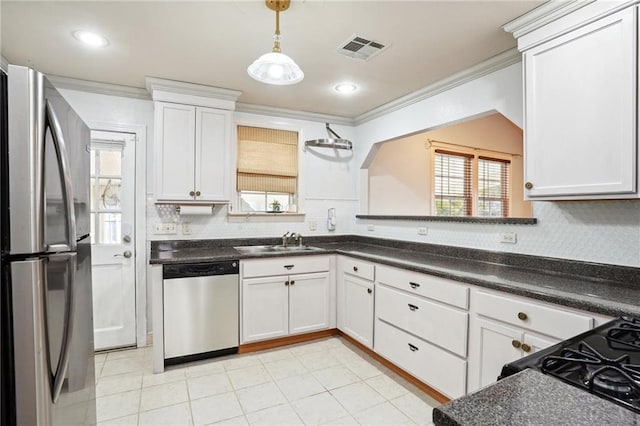 kitchen with sink, white cabinets, and stainless steel appliances