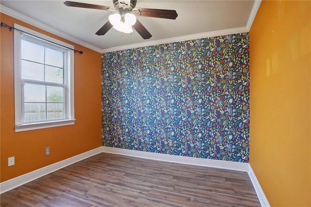 empty room featuring wood-type flooring, ceiling fan, and crown molding