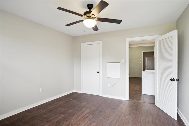 unfurnished bedroom with ceiling fan and dark wood-type flooring