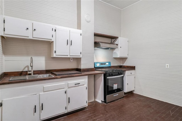 kitchen with sink, white cabinetry, dark wood-type flooring, and stainless steel range with gas stovetop