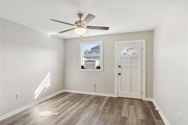 foyer featuring ceiling fan, light hardwood / wood-style flooring, and cooling unit